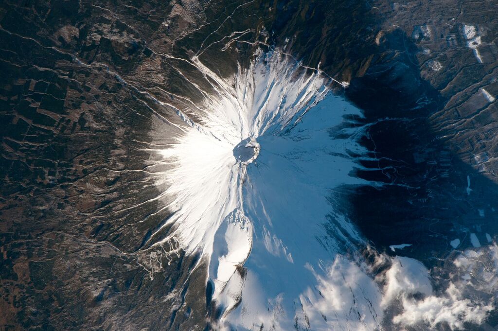 white peak of mount fuji as viewed from above