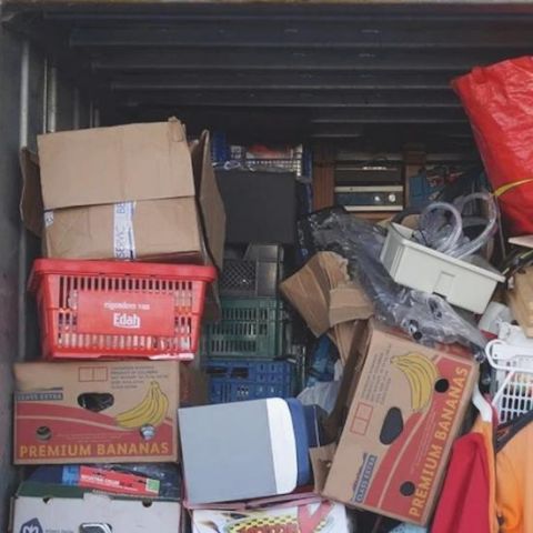 boxes stacked inside a storage unit or boxtruck