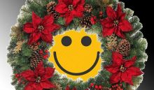 Yellow smiley face inside a Christmas wreath.