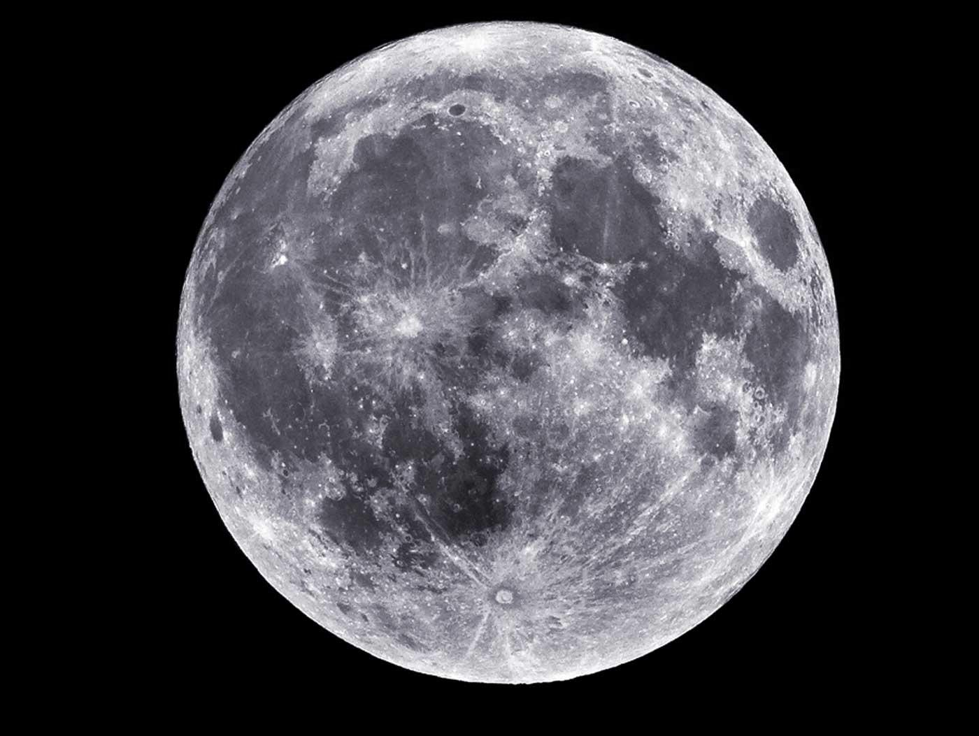 Image of the grey and white Super Moon against a black background